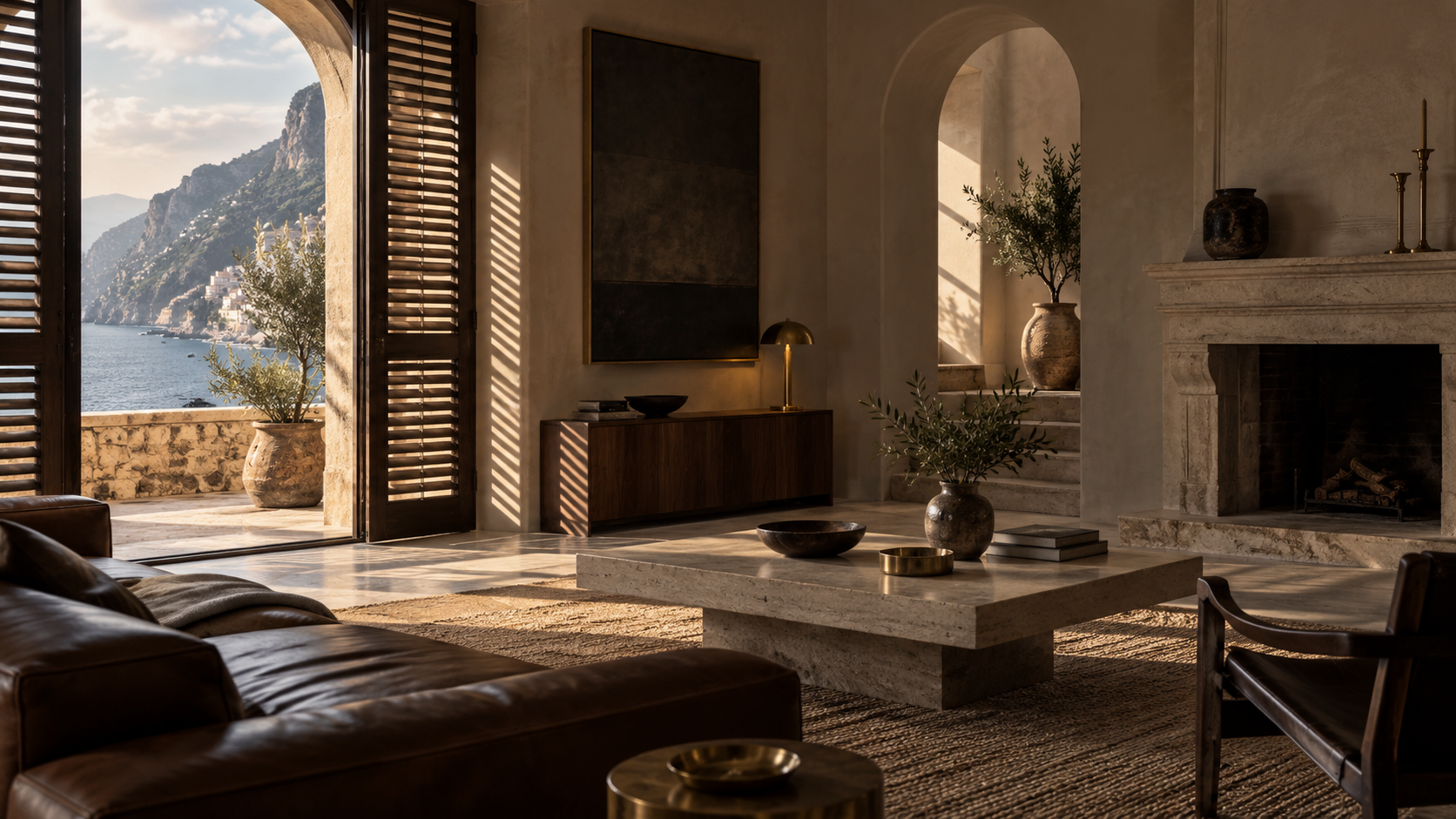 A composed private study lounge in a Mediterranean coastal villa, shuttered window light falling across leather, limestone, and brass.